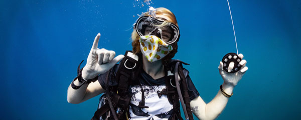 Staff member from the best dive school on Koh Tao enjoys the first dive after being out of the water for months.