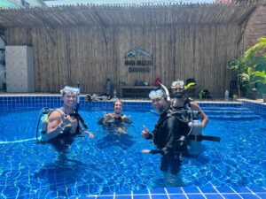 Divers in a swimming pool