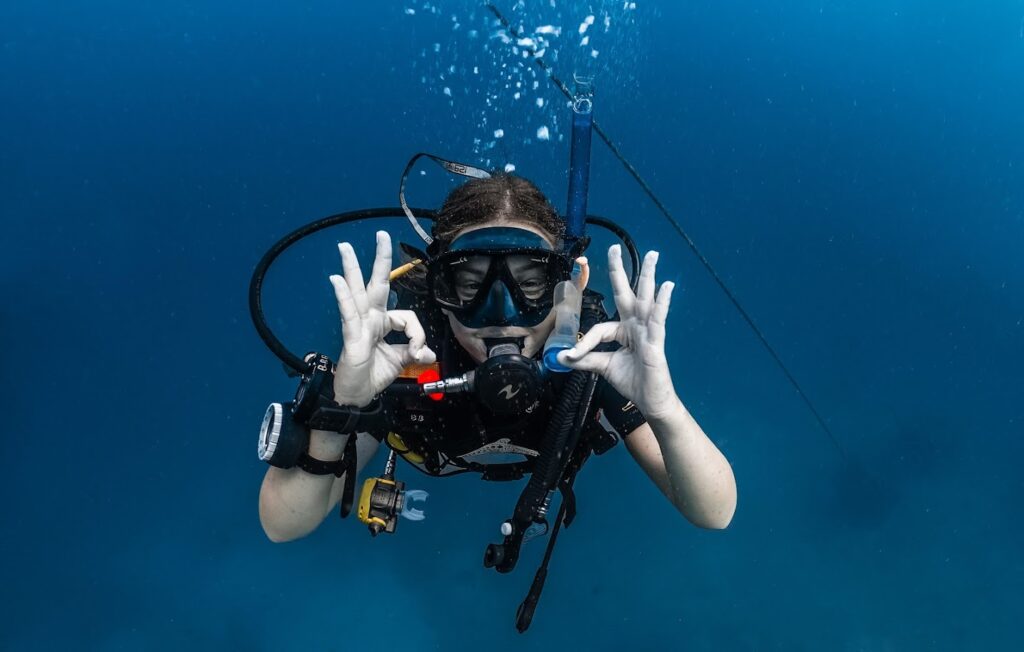A diver signaling OK